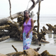 Queen Quet stands among damaged trees on Hunting Island, S.C.